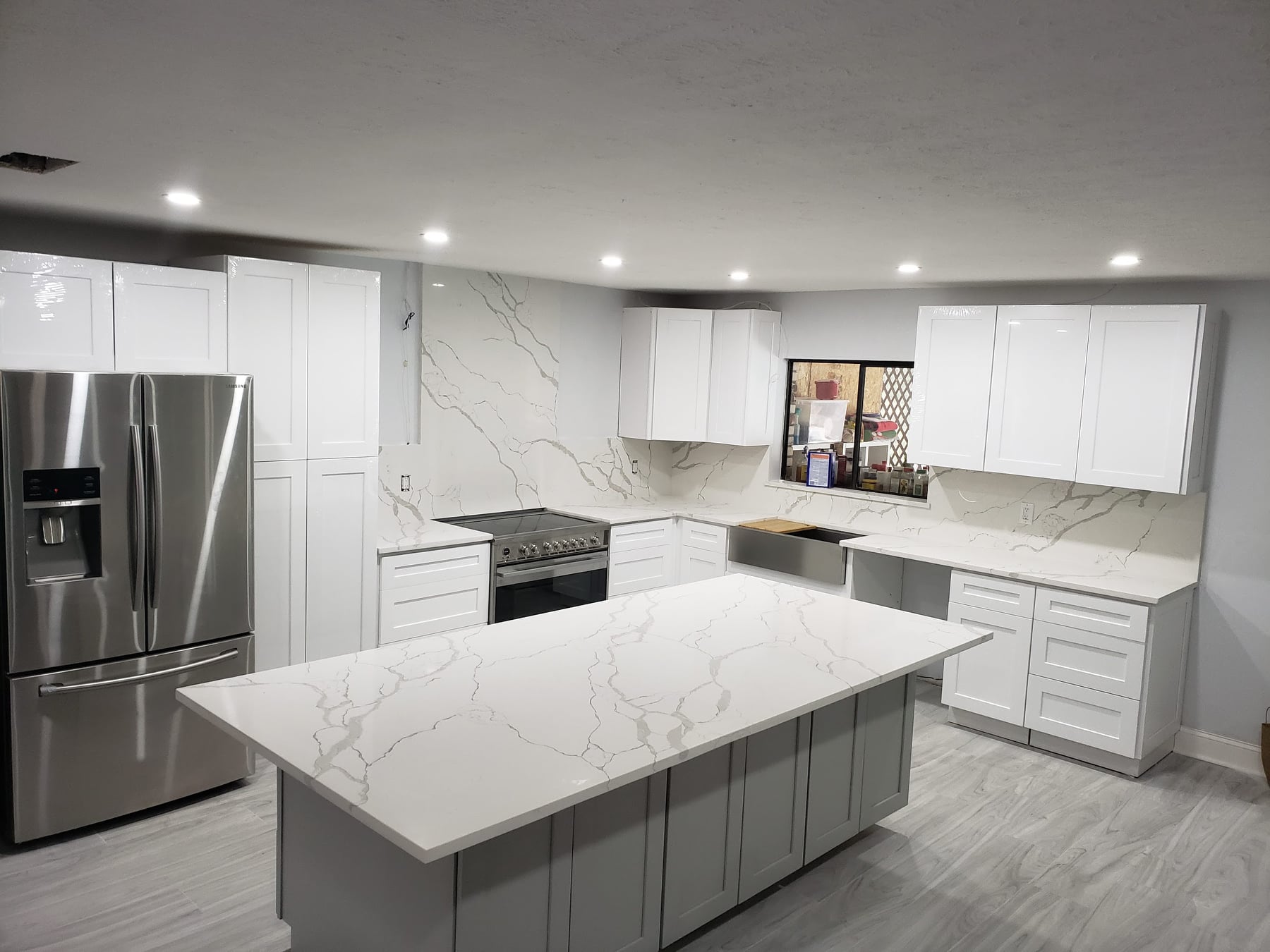 Kitchen with a white stone countertop