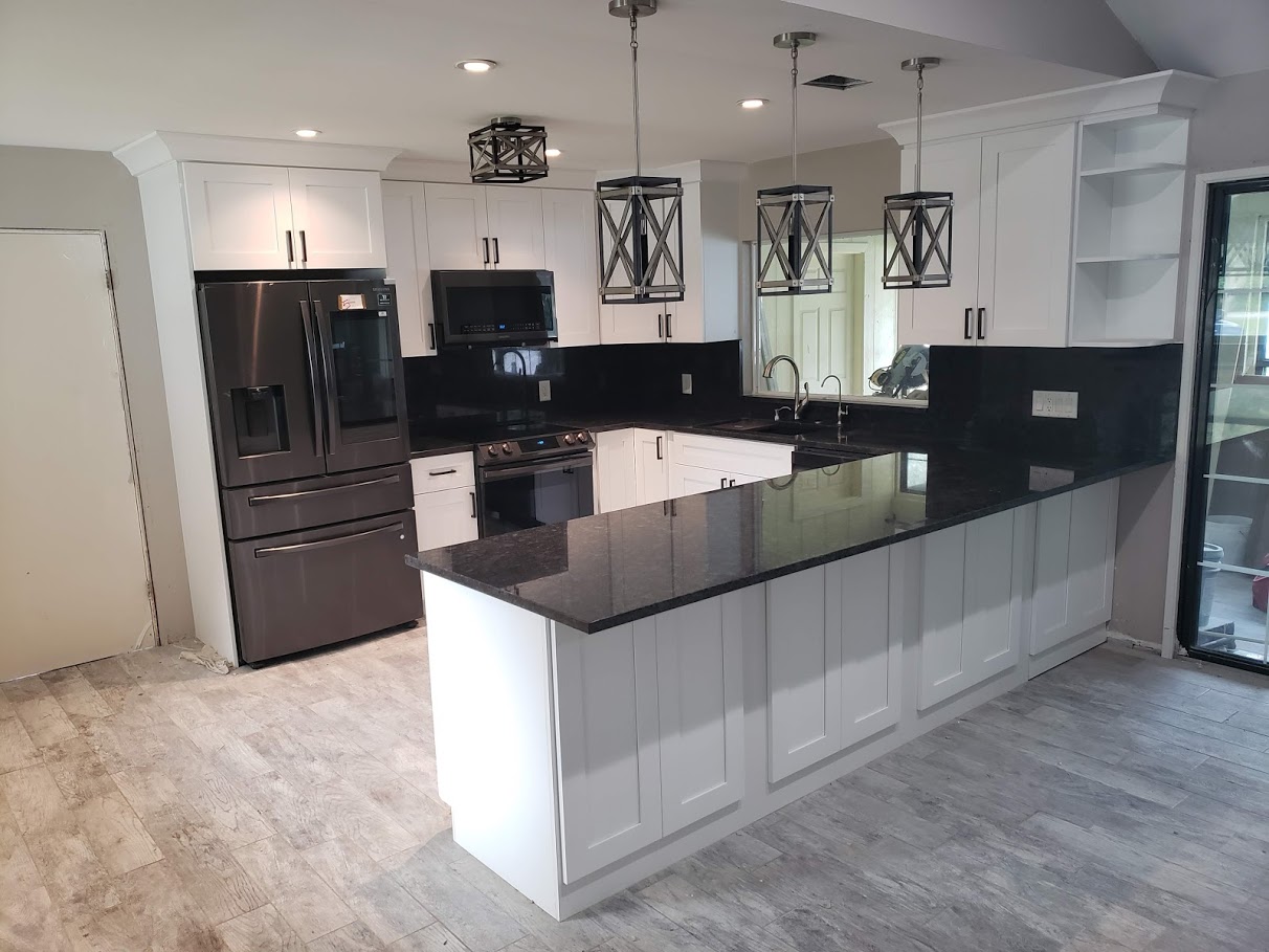 Kitchen with black stone countertop